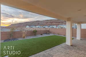 View of yard featuring a fenced backyard and a patio