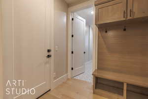 Mudroom featuring light wood-type flooring