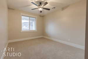 Unfurnished room featuring ceiling fan, carpet, visible vents, and baseboards