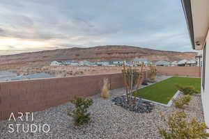 View of yard featuring a fenced backyard and a mountain view