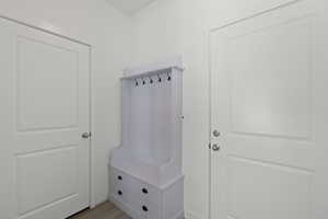 Mudroom with light wood finished floors