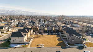 Birds eye view of property with a mountain view and a residential view