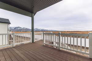 Wooden terrace featuring a mountain view