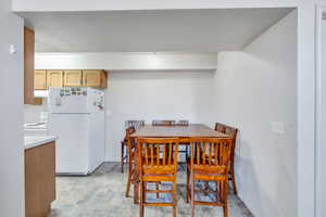 Dining space with stone finish flooring and baseboards