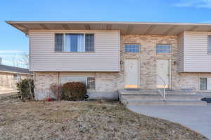 View of front facade featuring brick siding