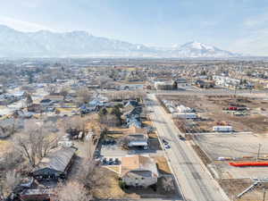 Birds eye view of property with a residential view and a mountain view