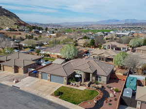 Birds eye view of property with a mountain view and a residential view