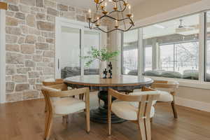 Dining area featuring a chandelier and light wood-type flooring