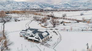 Snowy aerial view featuring a mountain view