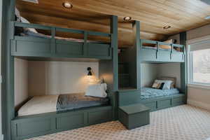 Bedroom featuring recessed lighting, wood ceiling, light carpet, and baseboards