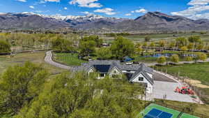 Aerial view featuring a water and mountain view