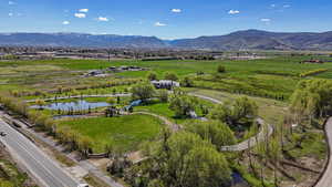 Drone / aerial view with a rural view and a water and mountain view