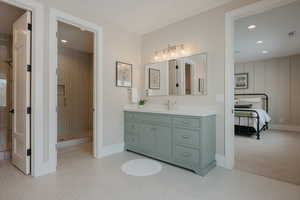 Bathroom with recessed lighting, visible vents, vanity, a shower stall, and baseboards