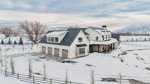 Exterior space with a garage and a mountain view