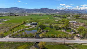 Birds eye view of property with a rural view and a water and mountain view