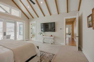 Bedroom with light carpet, high vaulted ceiling, beam ceiling, and access to exterior