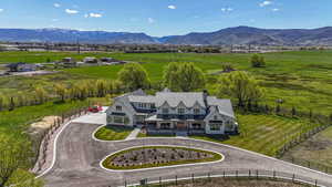 Aerial view featuring a rural view and a mountain view