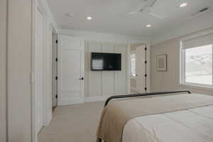 Bedroom featuring light carpet, ceiling fan, visible vents, and recessed lighting