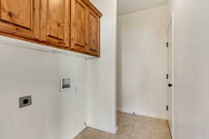 Main Floor Laundry with cupboards