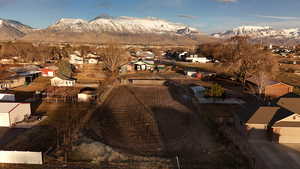 Birds eye view of property with a residential view and a mountain view