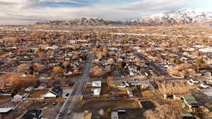 Drone / aerial view with a residential view and a mountain view