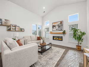 Living room with vaulted ceilings and cozy fireplace.