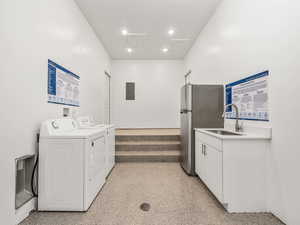 Common breezeway with additional fridge, washer and dryer that are owned by the HOA.