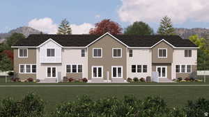 View of front of house with entry steps, a mountain view, and a front lawn