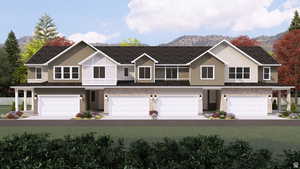 Townhome / multi-family property featuring a garage, stone siding, and a mountain view