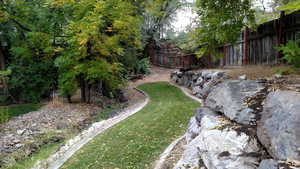 View of yard featuring fence