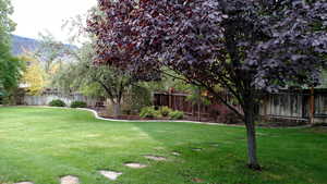 View of yard with a fenced backyard