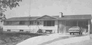 View of front of house with an attached carport