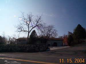 View of front of home featuring uncovered parking