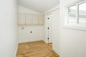 Laundry room with custom cabinetry.