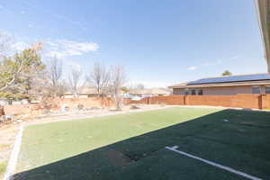 View of yard featuring a fenced backyard