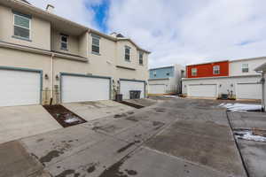 Exterior space featuring central AC unit and stucco siding
