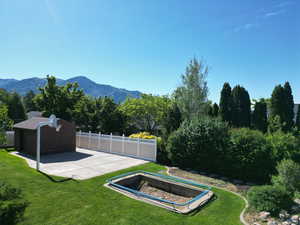 View of yard with a mountain view and a patio area