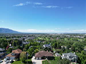 View of property location with nearby suburban area and mountains
