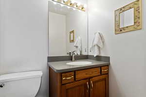 Bathroom with toilet and vanity