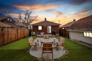 Exterior space featuring a fenced backyard and a patio