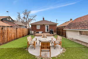 View of yard featuring a patio and a fenced backyard