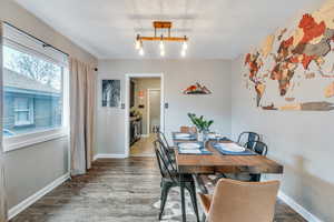 Dining area with baseboards and wood finished floors