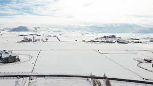 Snowy aerial view with a mountain view