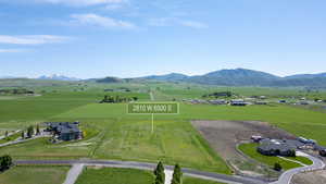 Aerial view of sparsely populated area with a mountain backdrop