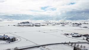 Snowy aerial view featuring a mountain view