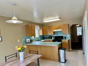 Bright and airy kitchen adjacent to the dining and private patio area for entertaining and relaxing