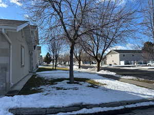 View of yard layered in snow