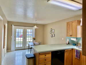 Dining room with patio conveniently connected through french doors filling the area with natural light