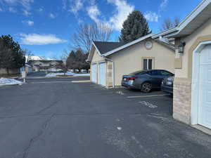 Exterior space with  garage and stucco siding