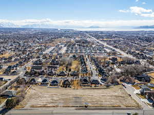 Birds eye view of property with a residential view and a mountain view